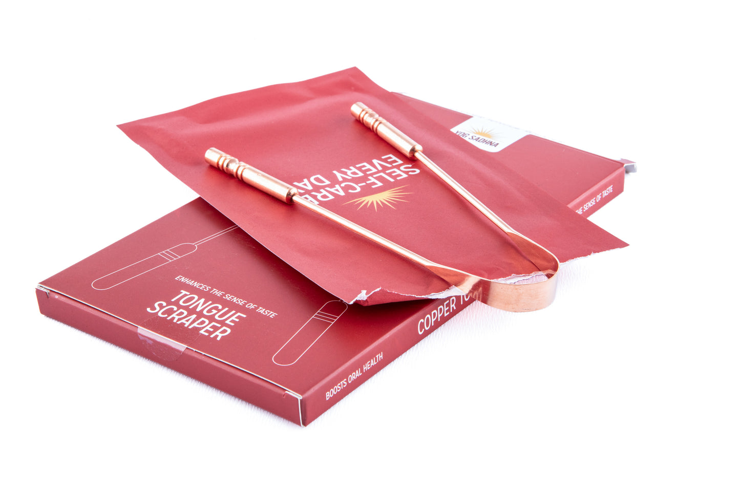 Copper tongue scraper in use – morning Ayurvedic routine